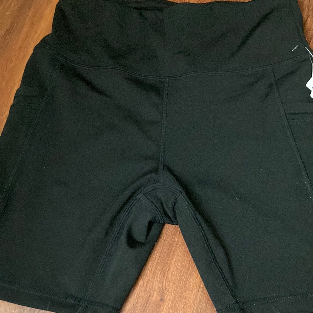 Brand new workout shorts with pockets